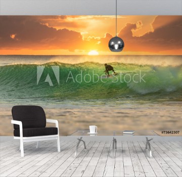 Bild på Surfer Surfing at Sunrise